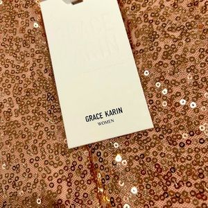 Stunning fitted rose gold dress. Never worn. Tag is still on.